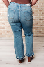 Load image into Gallery viewer, Judy Blue Isla Mid Rise Distressed Released Hem Bootcut Jeans
