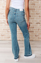 Load image into Gallery viewer, Judy Blue Isla Mid Rise Distressed Released Hem Bootcut Jeans
